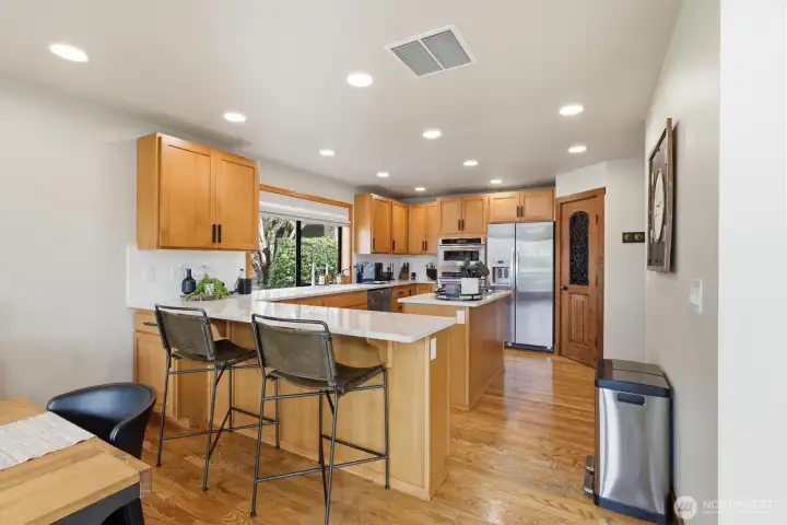 Beautiful kitchen with plenty of cabinets and extra eating space.
