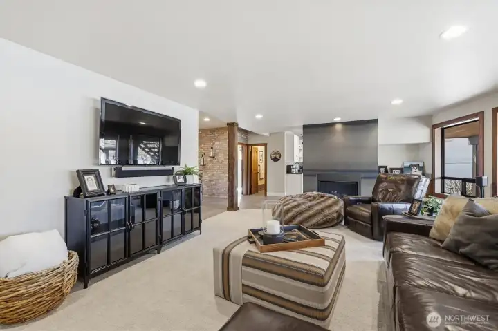 Lower level was recently remodeled including the gorgeous steel-wrapped fireplace.