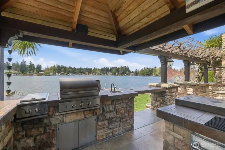 Cabana bar includes sink, BBQ (plumbed with gas), cook-top, fridge, and kegerator with two beer taps.