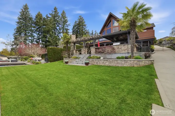 Usable flat lawn space between the patio and dock.  Great for summer games!
