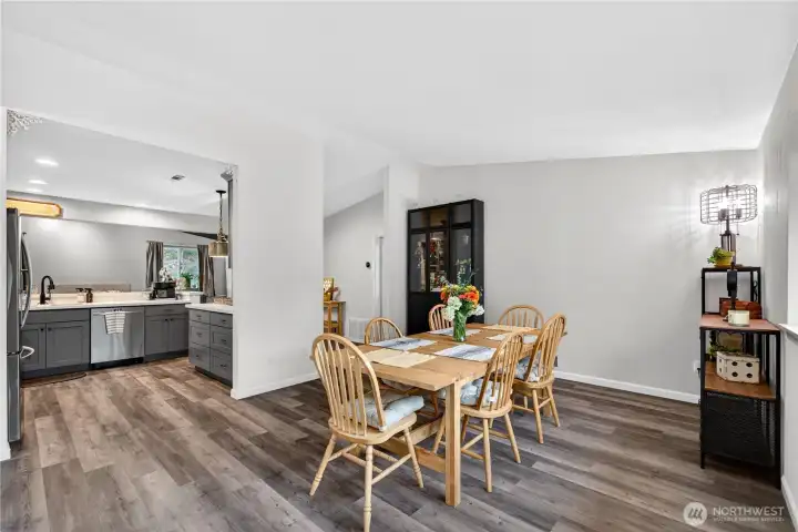 Seamless flow from dining to the beautifully updated kitchen, featuring stylish finishes and a layout designed for connection and convenience.