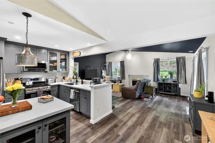 Expansive open living with a beautifully updated kitchen flowing into a warm, inviting living room—designed for comfort and gathering.