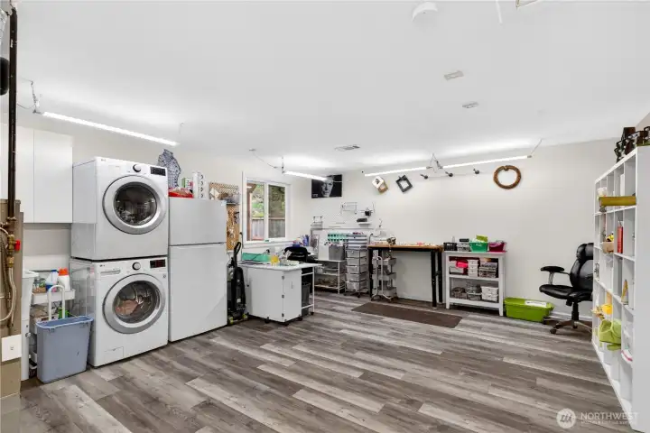 Expansive garage with bonus workspace area—ideal for projects, storage, or a home gym setup.