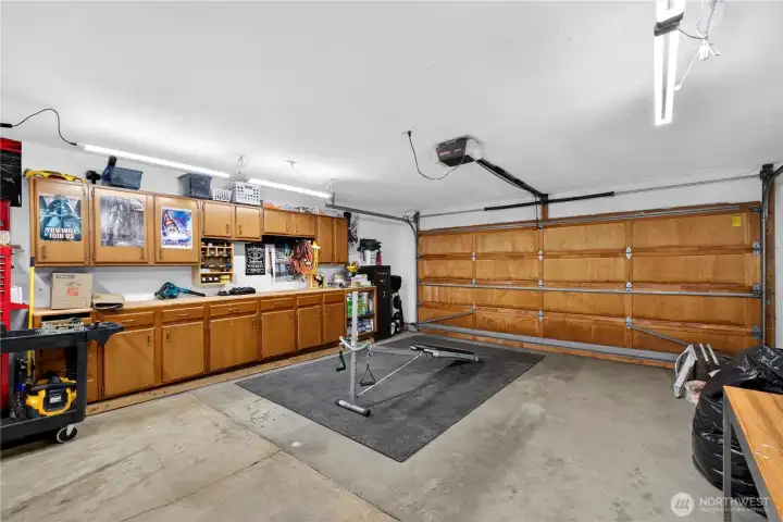 Expansive garage with bonus workspace area—ideal for projects, storage, or whatever your vision creates!