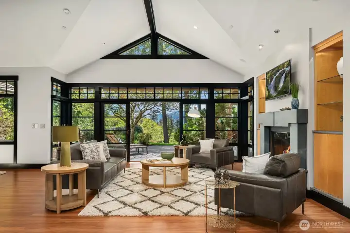 The epitome of indoor-outdoor living, with soaring ceilings and wall of windows.