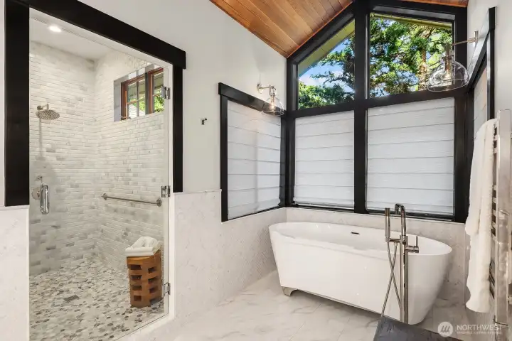 Massive spa bath with soaking tub, marble shower, and sauna.