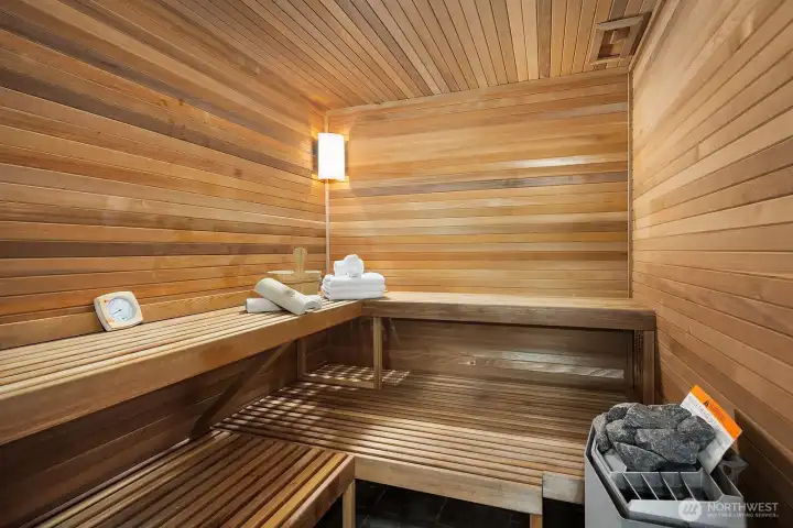 Massive spa bath with soaking tub, marble shower, and sauna.