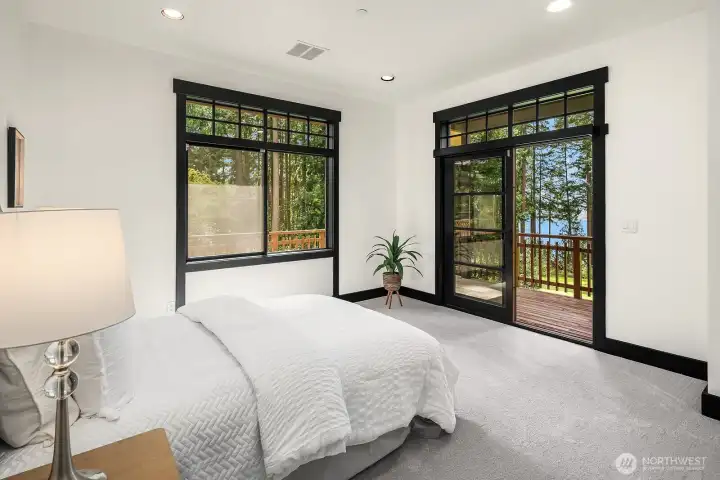 West wing bedroom has deck and Lake Sammamish views.