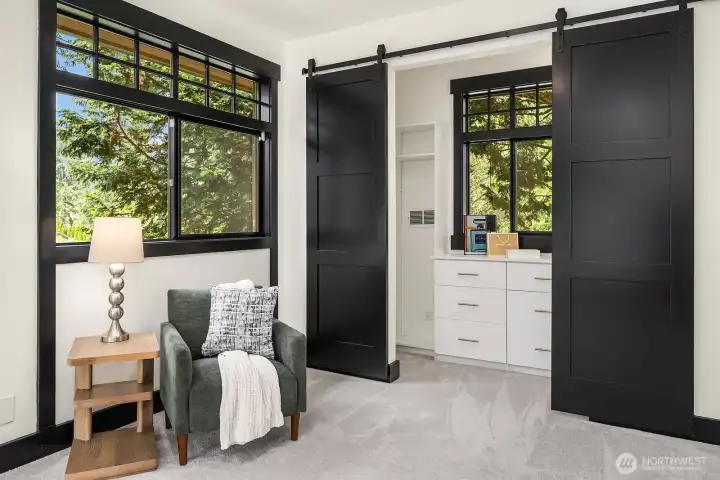 West wing bedroom has deck and Lake Sammamish views.