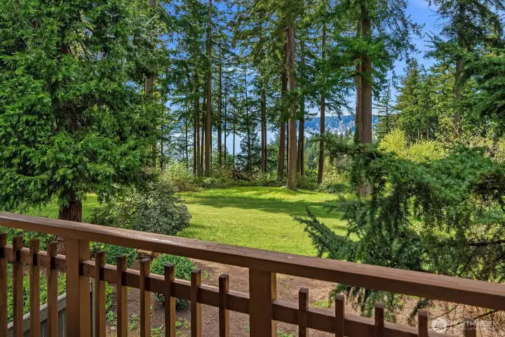 West wing bedroom has deck and Lake Sammamish views.