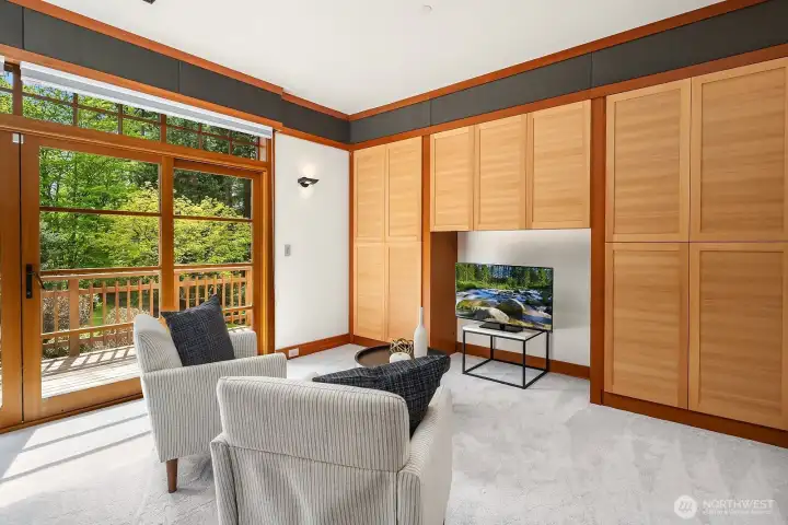 Middle bedroom with fir woodwork and view deck.