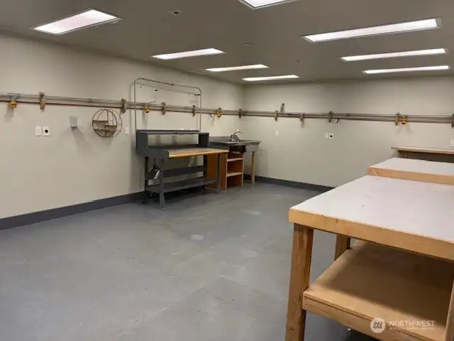 Lower level heated workshop with compressor and vacuum systems.