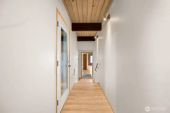 The main entrance is a great place to hang a variety of pictures or artwork. Garage door also leads into the main entrance.