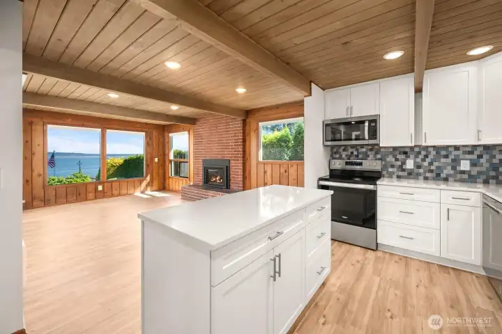 Beautiful kitchen cabinets with quartz counter tops.