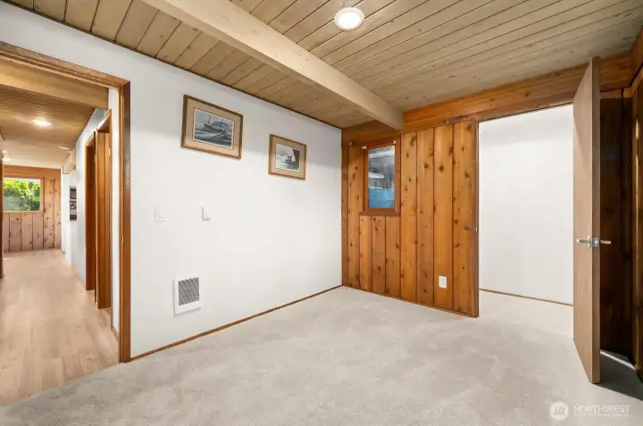 2nd bedroom has a large walkin in closet and carpeting.