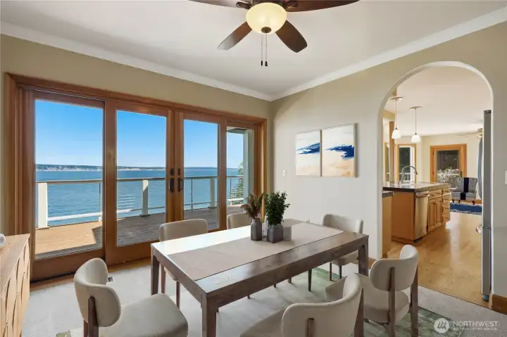 Dining room is neatly situated off the kitchen with views and access to the deck.