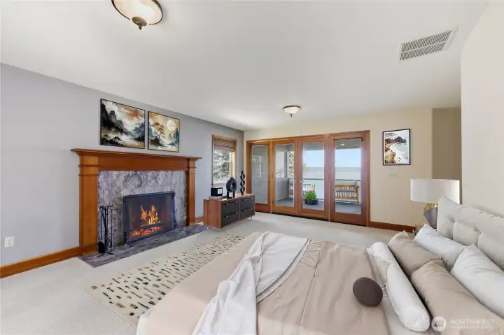 Primary Bedroom has a fireplace, a complete suite with a walk-in closet, ensuite bathroom and private covered balcony