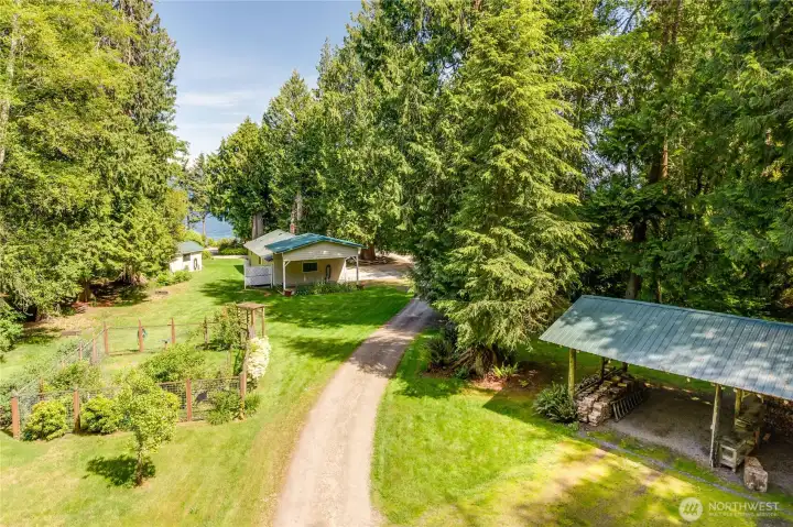 On the drive into the main house, you pass covered storage, fenced garden area, the shop space with covered boat/RV storage... all before you are actually there.