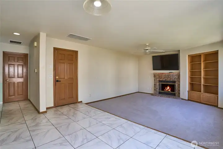 Another View of the Family Room with Brick Surround Gas Fireplace and Built-in Shelves. Another View of the Family Room with Brick Surround Gas Fireplace and Built-in Shelves.