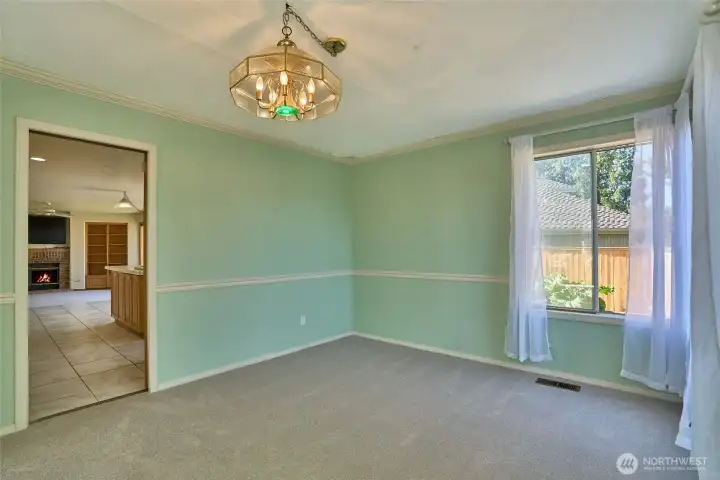 Big Formal Dining Room with a View into the Kitchen and Family Room. Big Formal Dining Room with a View into the Kitchen and Family Room.