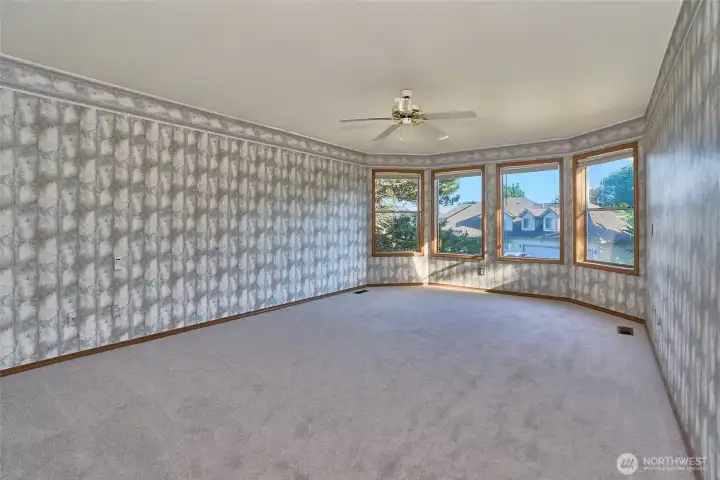 Very Large Primary Bedroom, with Ceiling Fan and a View of Mount Rainier. Very Large Primary Bedroom, with Ceiling Fan and a View of Mount Rainier.