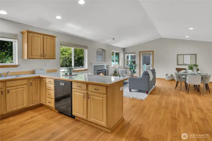Kitchen opens to great room with vaulted ceilings! Open kitchen with stone counters- all appliances stay! New interior paint throughout!