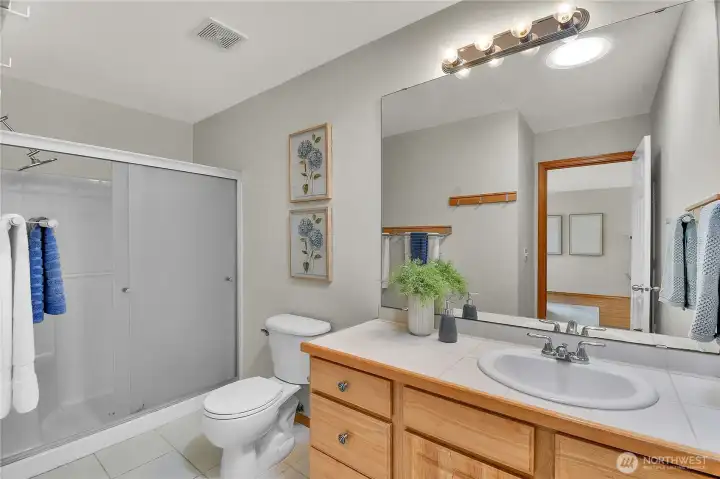 Full hall bathroom with tub.