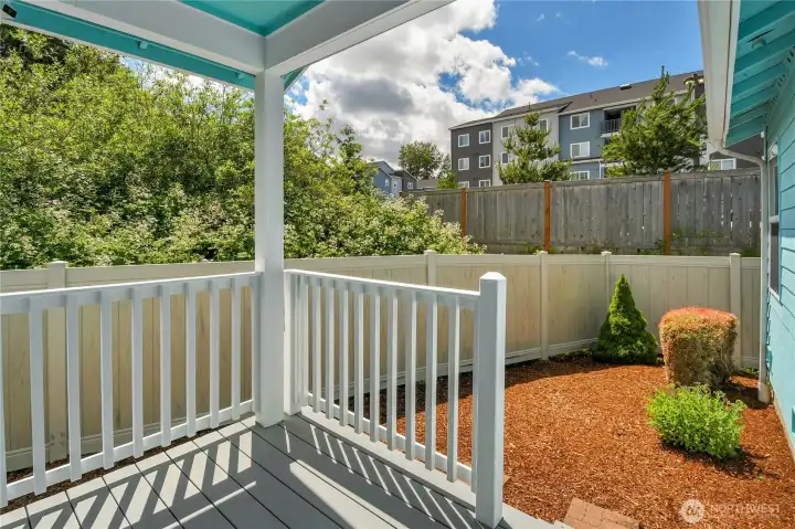 Covered patio on back of home in fenced backyard!