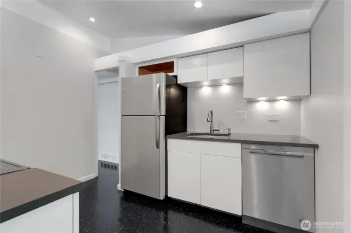 Beautifully updated kitchen with hard-surface countertops and new stainless appliances.