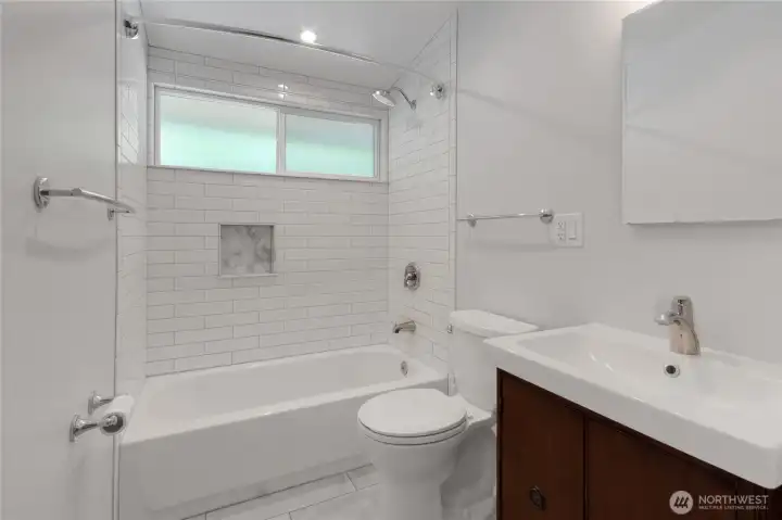 Primary suite bathroom, completely remodeled and a comfortable place to begin and end your day.
