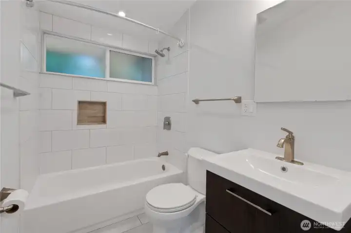 Main bathroom completely updated with modern styling and ready for comfortable accommodation for your guests.