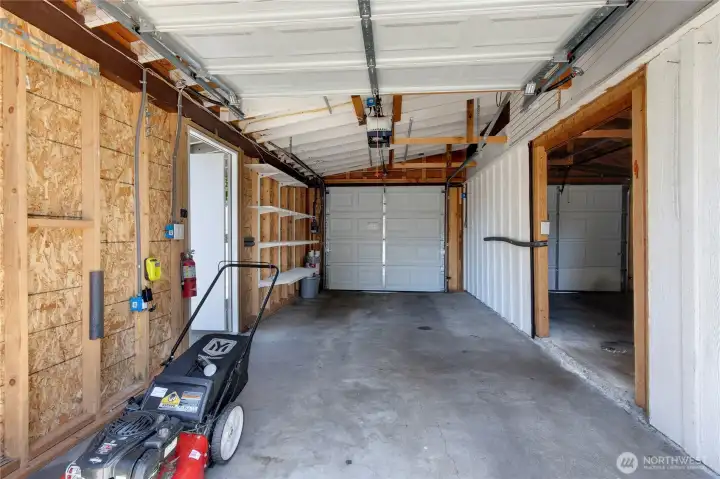 Pull through garage with room for 4 cars tandem. Or also set up where one side could be a shop area.
