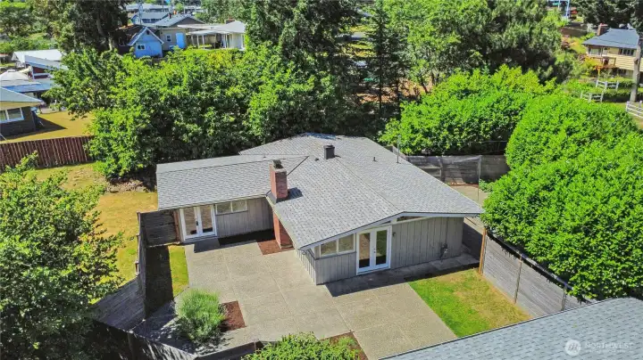 Arial view of the home showing the front courtyard and the front entrance on the right and the private Primary room entrance on the left.