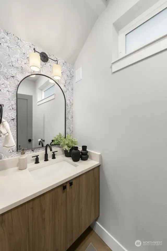 A convenient powder bath resides on the lower level for easy hosting!