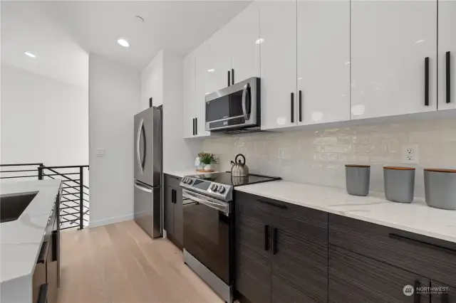 Sleek cabinetry and premium appliances make this kitchen a chef's dream.