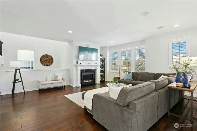 Beautiful hardwood floors and custom louvered shutters on the windows.