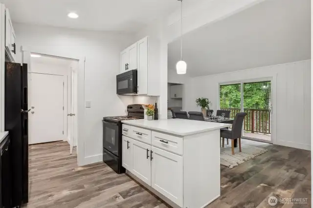 Kitchen opens to dining area