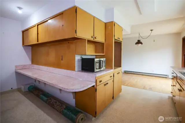 Eating area in kitchen, adjacent to formal dining area