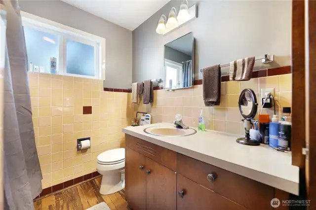 Main house bathroom with tub and shower
