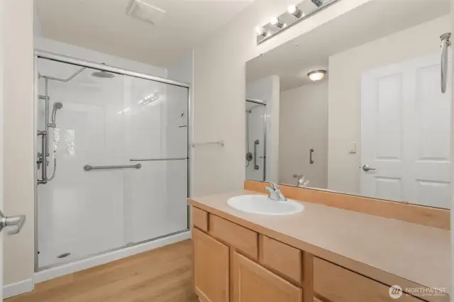 Guest hallway bathroom with custom walk in shower: glass surround, and rainhead
