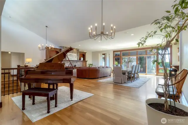 As you enter the heart of the home you are welcomed by rich hardwood floors, high vaulted ceiling and abundant natural light! Walls of glass beyond the dining area invite you to the outdoor living space. Wonderful areas to gather both inside and out!