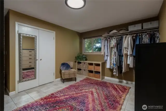 One of two large walk-in closets of off primary bedroom en-suite.