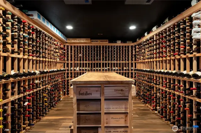 Spectacular! Two thousand + bottle wine cellar, with double insulated walls and ceiling, custom designed wine racks and center island.