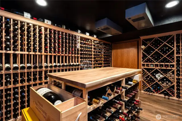 Cellar is temperature controlled with wine cellar specific cooling - dual (redundant) blowers and remote compressor, installed by Grassi.