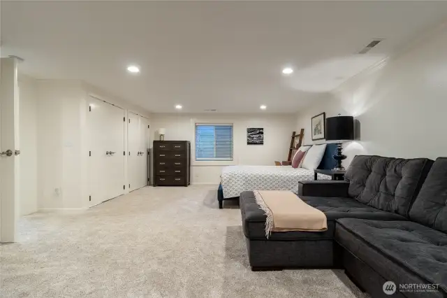 Bedroom suite #4 located on lower level, with legal egress.