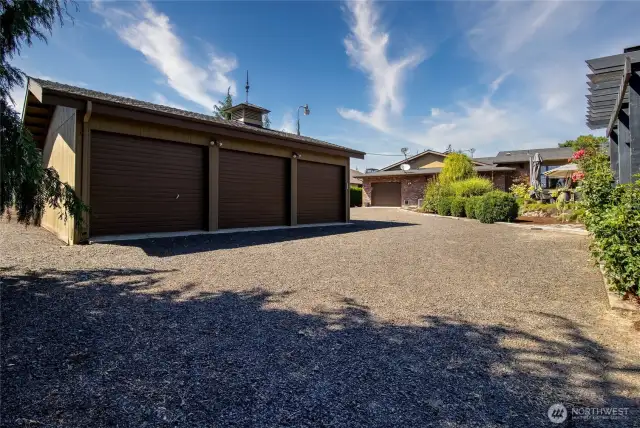 Three bay shop with RV parking on backside, plus additional space for boats and other toys!
