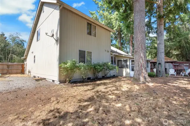 The yard is supersized. Door to the left allows for trailers, etc to be brought in and stored, or put in a pool, or?