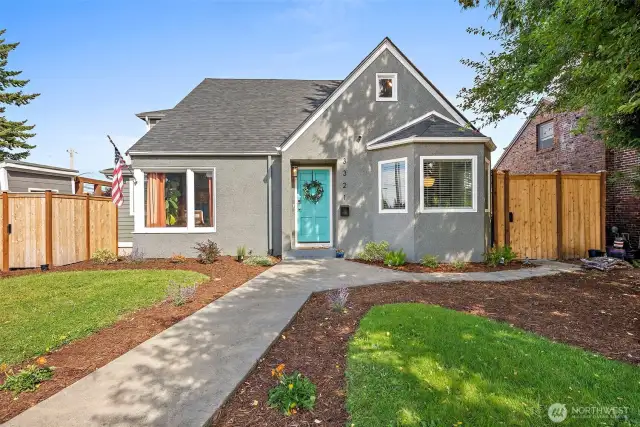 Large corner lot with manicured landscaping.