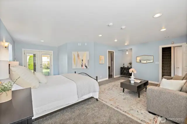 Primary suite offers perfect retreat space to lounge, soak in the tub, get dressed in the natural lit custom closet off the en-suite bathroom.