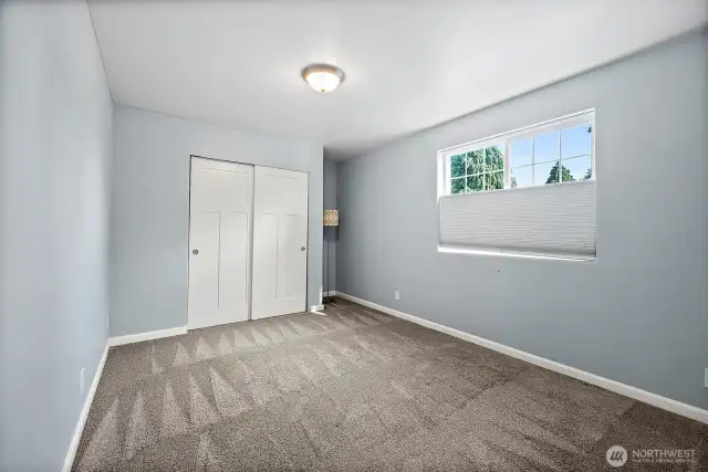 Large 2nd Bedroom on main floor with closet & large window to wake up to natural light.